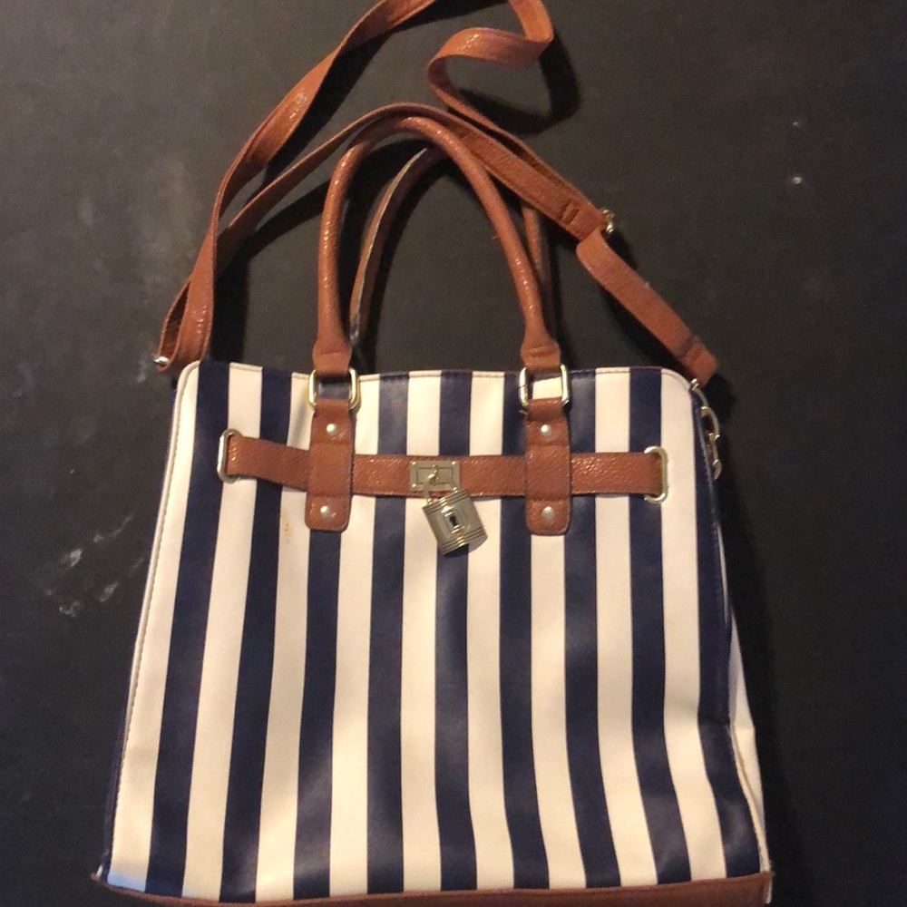 Blue and white stripe purse with brown trim